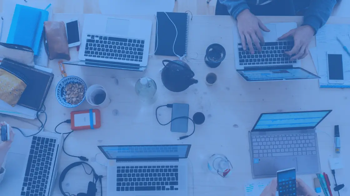image of a table with different computers