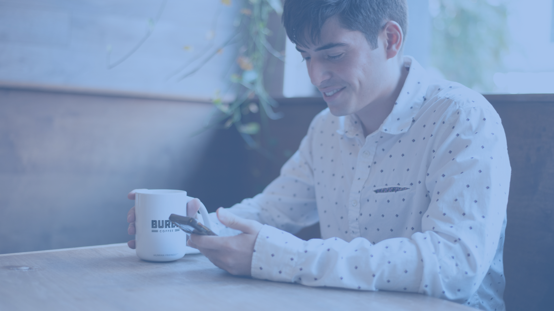 business person reading sms benchmarks on his phone
